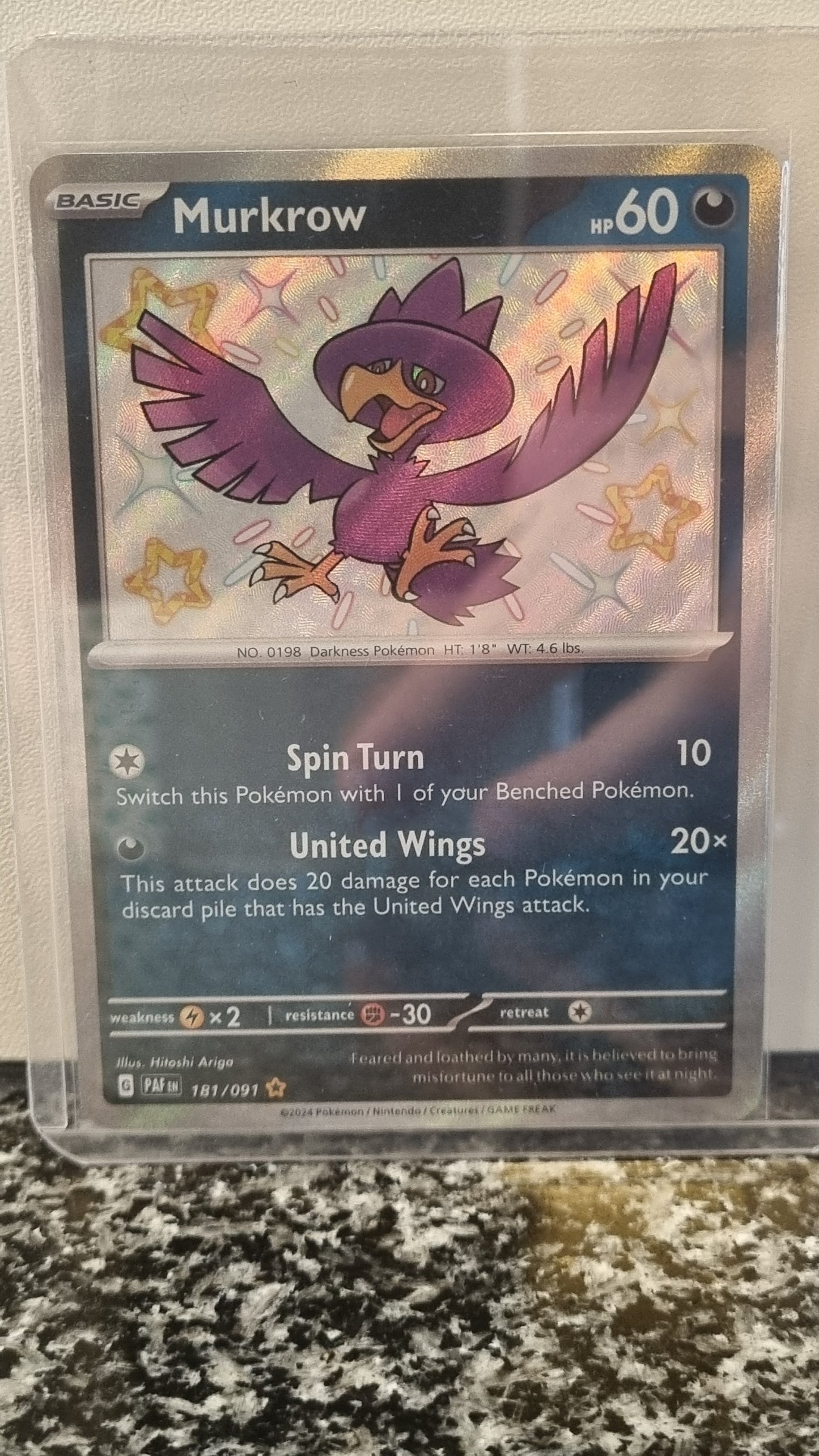 Murkrow (Paldean Fates #181) 🇺🇸 (Alt)