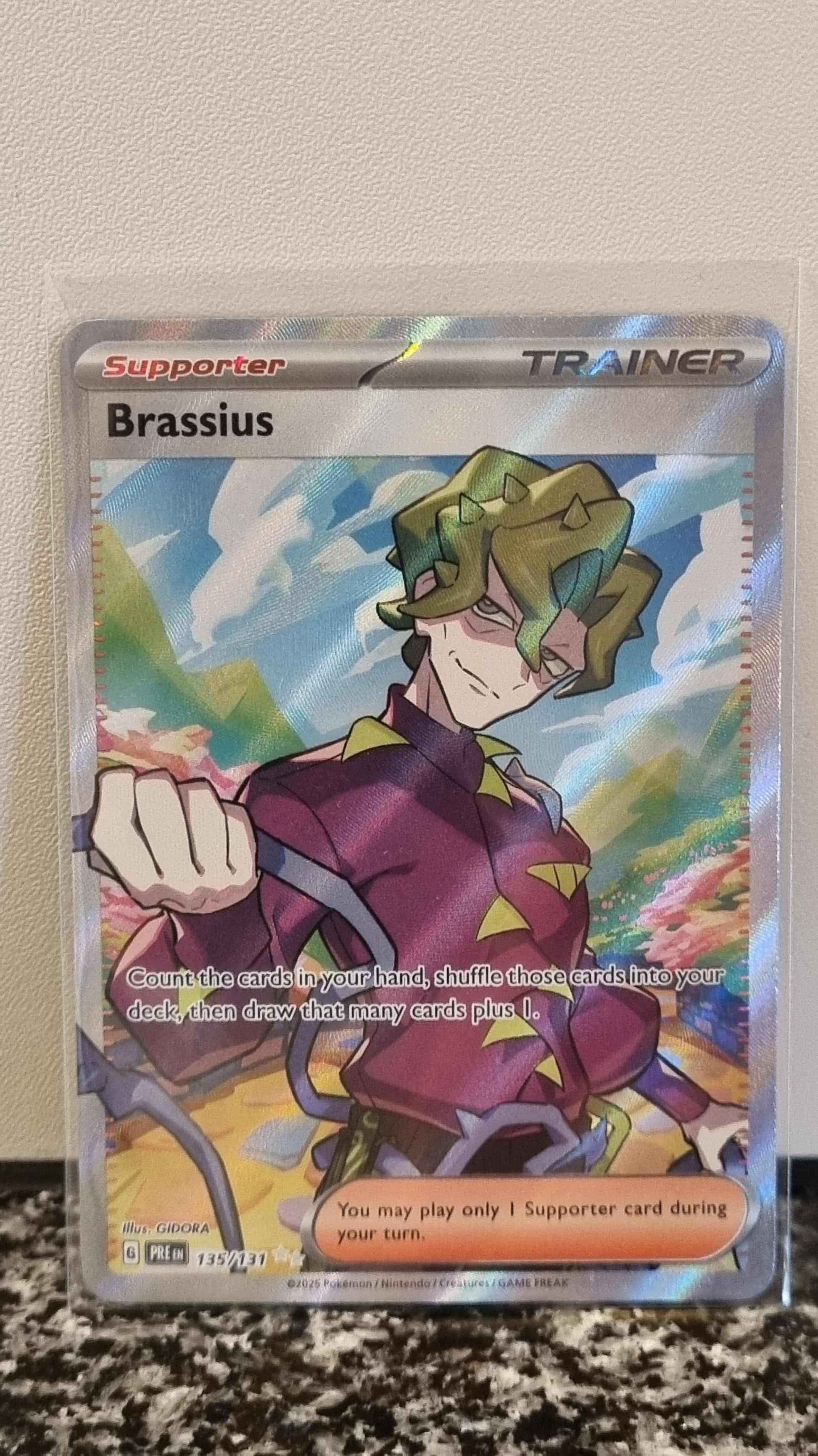 Brassius (Prismatic Evolutions #135) 🇺🇸 (Alt)